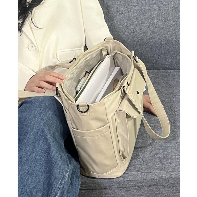 Waterproof nylon fabric crossbody bag with large capacity and lightweight tote bag, book and computer bag, commuting portable shoulder bag