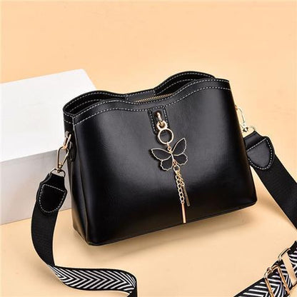 2024 Spring/Summer New Fashion Solid Color Shoulder Bag Versatile Casual Strap Bag Wide Shoulder Strap Simple and Elegant Bucket Bag Butterfly Decoration Women's Bag