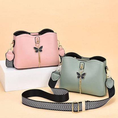 2024 Spring/Summer New Fashion Solid Color Shoulder Bag Versatile Casual Strap Bag Wide Shoulder Strap Simple and Elegant Bucket Bag Butterfly Decoration Women's Bag