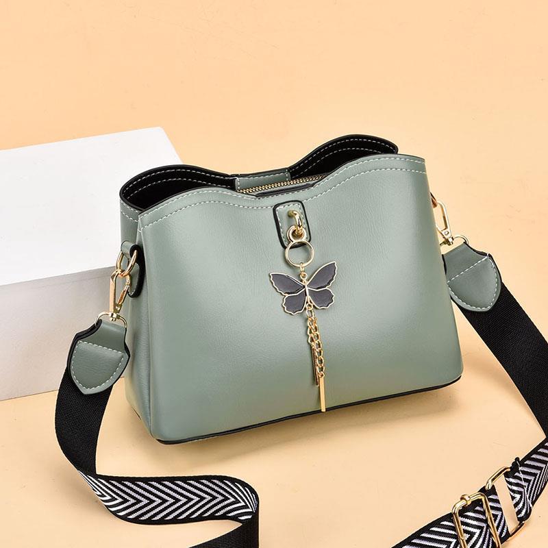 2024 Spring/Summer New Fashion Solid Color Shoulder Bag Versatile Casual Strap Bag Wide Shoulder Strap Simple and Elegant Bucket Bag Butterfly Decoration Women's Bag