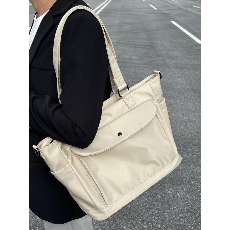 Waterproof nylon fabric crossbody bag with large capacity and lightweight tote bag, book and computer bag, commuting portable shoulder bag