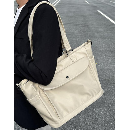 Waterproof nylon fabric crossbody bag with large capacity and lightweight tote bag, book and computer bag, commuting portable shoulder bag