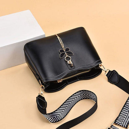 2024 Spring/Summer New Fashion Solid Color Shoulder Bag Versatile Casual Strap Bag Wide Shoulder Strap Simple and Elegant Bucket Bag Butterfly Decoration Women's Bag