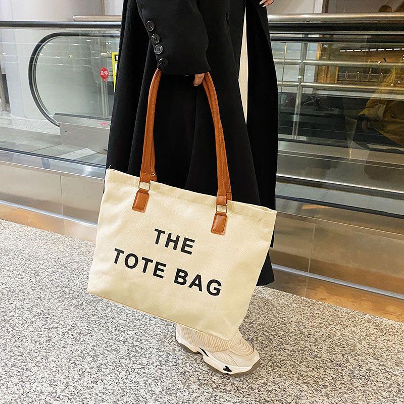 Canvas bag women's large capacity bag 2024 autumn and winter new fashion retro letter shoulder bag versatile portable shopping bag simple casual temperament large canvas bag women