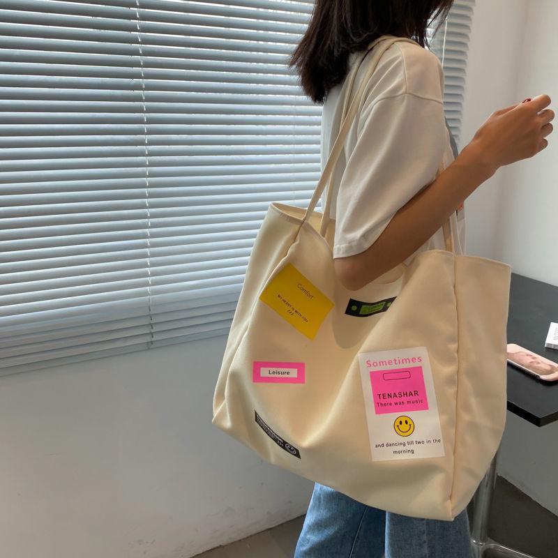 Casual shoulder bag school bag Korean version ins letter printing open thin shoulder strap large-capacity canvas bag female simple