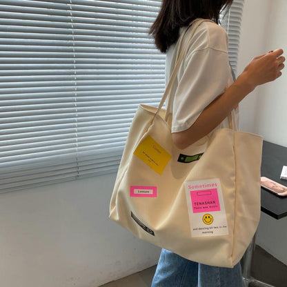 Casual shoulder bag school bag Korean version ins letter printing open thin shoulder strap large-capacity canvas bag female simple