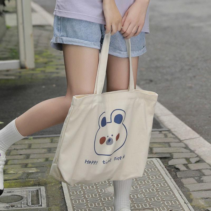 Cartoon canvas bag female 2024 new large-capacity canvas bag female Harajuku shoulder bag simple handbag canvas large bag student schoolbag