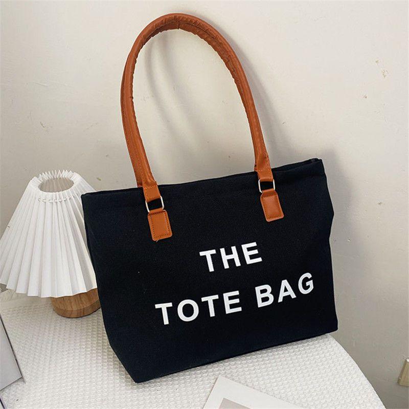 Canvas bag women's large capacity bag 2024 autumn and winter new fashion retro letter shoulder bag versatile portable shopping bag simple casual temperament large canvas bag women