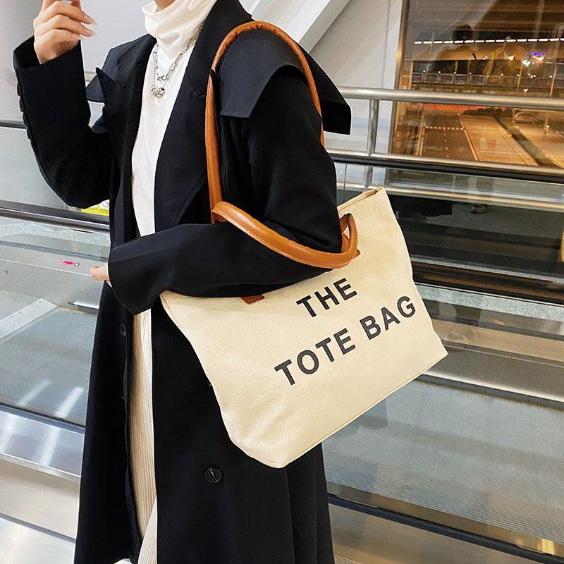 Canvas bag women's large capacity bag 2024 autumn and winter new fashion retro letter shoulder bag versatile portable shopping bag simple casual temperament large canvas bag women