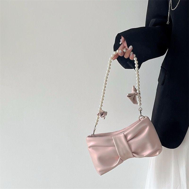 Girls' pearl bow underarm women's bag 2024 new fresh fairy bag Korean version shoulder bag portable messenger bag high-quality women's bag pink women's bag delicate handbag wedding bag