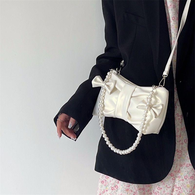 Girls' pearl bow underarm women's bag 2024 new fresh fairy bag Korean version shoulder bag portable messenger bag high-quality women's bag pink women's bag delicate handbag wedding bag