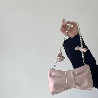 Girls' pearl bow underarm women's bag 2024 new fresh fairy bag Korean version shoulder bag portable messenger bag high-quality women's bag pink women's bag delicate handbag wedding bag