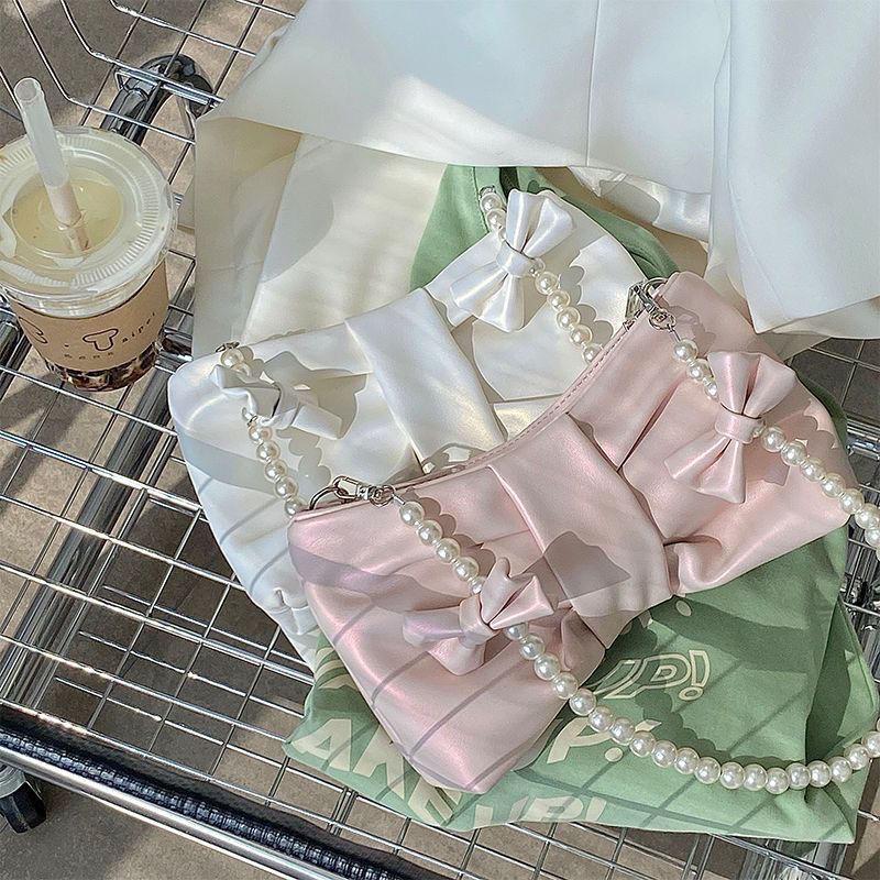 Girls' pearl bow underarm women's bag 2024 new fresh fairy bag Korean version shoulder bag portable messenger bag high-quality women's bag pink women's bag delicate handbag wedding bag