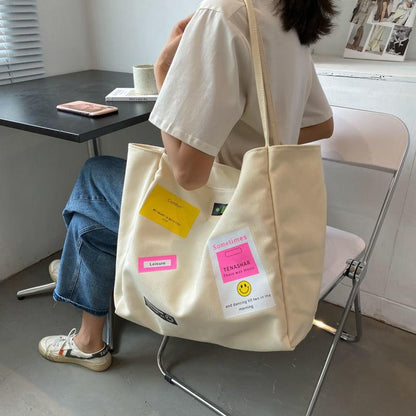 Casual shoulder bag school bag Korean version ins letter printing open thin shoulder strap large-capacity canvas bag female simple