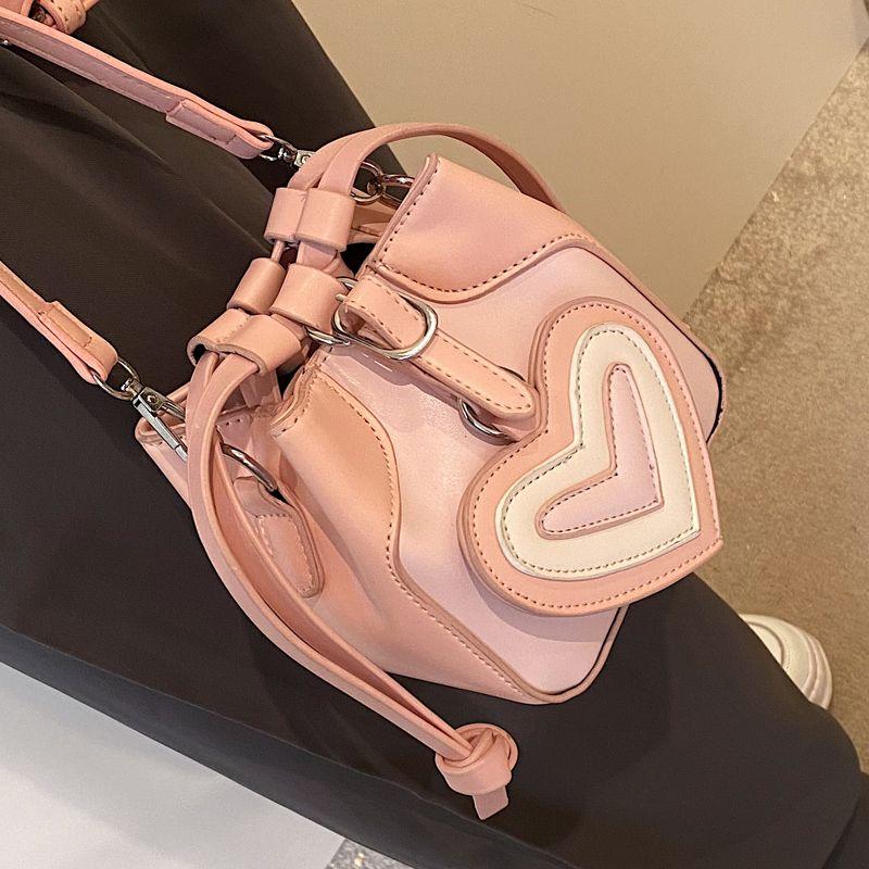 Pink Cute Small Fresh High Grade Peach Heart Decorative Bucket Bag Women's Spring/Summer 2024 New Korean Version Clever Simple Sweet Daily Versatile Shoulder Bag ins Gentle Delicate Small Crossbody Bag