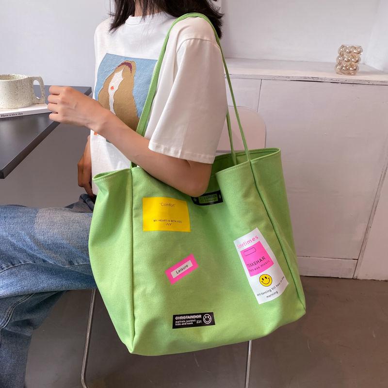 Casual shoulder bag school bag Korean version ins letter printing open thin shoulder strap large-capacity canvas bag female simple