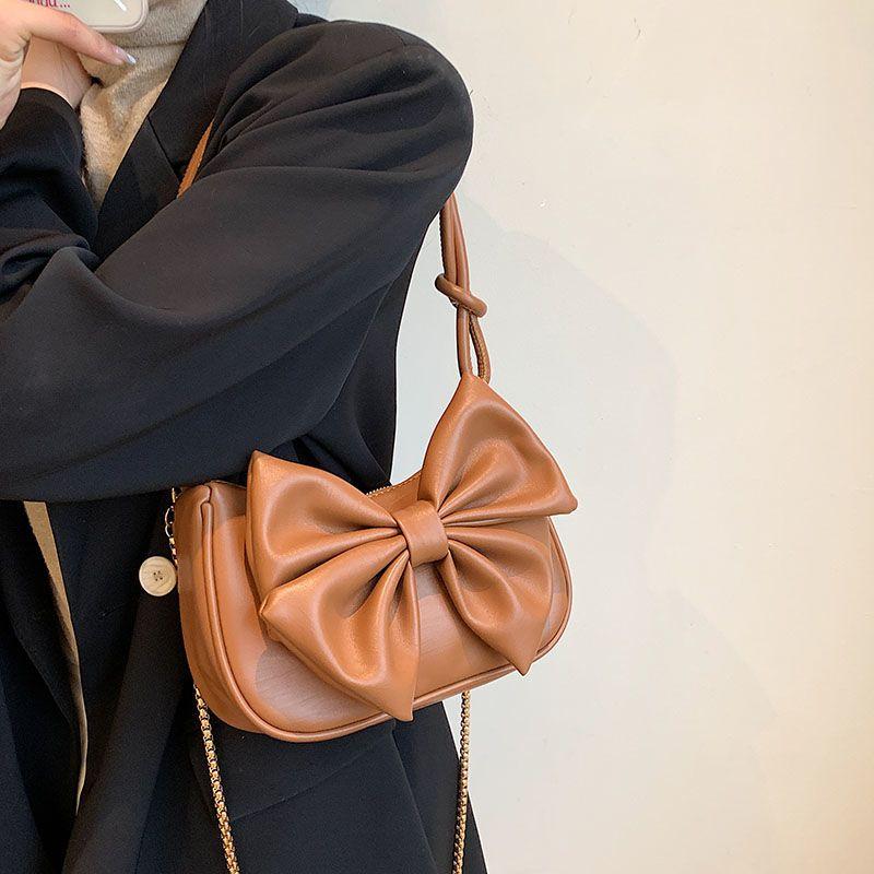 Advanced sense chain small bag women's 2024 new versatile underarm bag single shoulder bag texture messenger bag bow cute leather bag fashion portable small bag sweet style women's bag